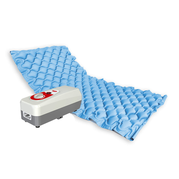 A portable anti-decubitus medical air mattress with its air pump, designed to prevent bedsores and pressure ulcers.