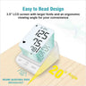 Digital blood pressure monitor with large display on a wooden surface, featuring text about its design.