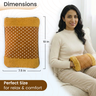 Woman holding a polka dot heating pad with dimensions displayed