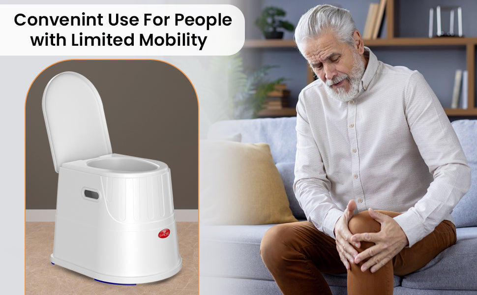 White commode chair on a wooden floor with an elderly man sitting on a couch holding his knee.