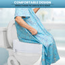 A promotional image demonstrating a white commode riser attached to a toilet bowl. An elderly person wearing a blue floral gown is shown sitting on the elevated seat, illustrating the product's use. Text at the top of the image reads, "COMFORTABLE DESIGN: Makes it easier for users to sit or stand.